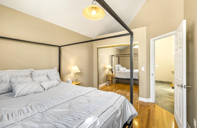 4371 E Savannah Cir, Flagstaff, AZ 86004 - bedroom with baseboards, light wood-style floors, a closet, and lofted ceiling