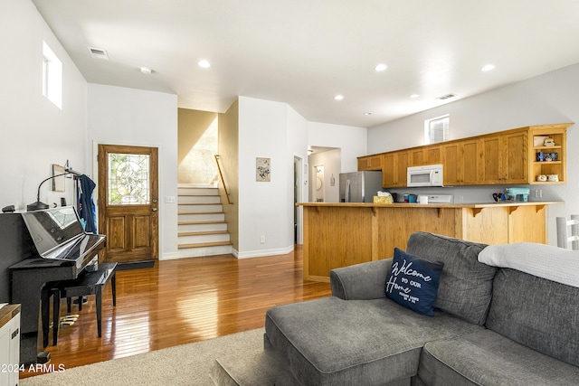 4371 E Savannah Cir, Flagstaff, AZ 86004 - living room with visible vents, wood finished floors, stairway, and recessed lighting