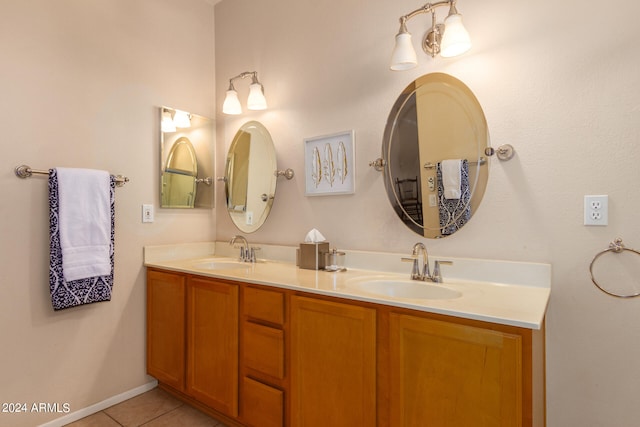 bathroom featuring tile patterned flooring and vanity