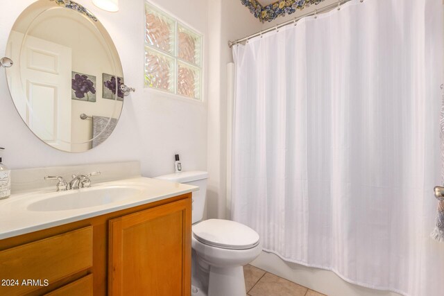 full bathroom featuring vanity, toilet, tile patterned floors, and shower / bathtub combination with curtain