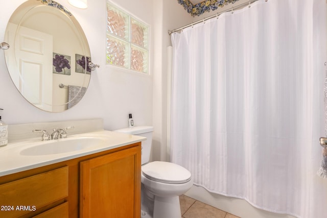 bathroom featuring tile patterned flooring, vanity, and toilet