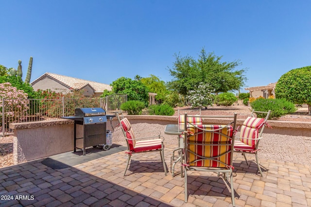 view of patio with fence and grilling area