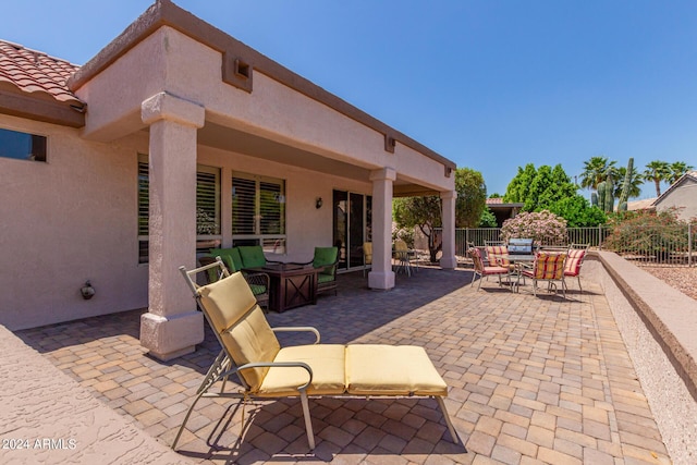 view of patio / terrace featuring fence