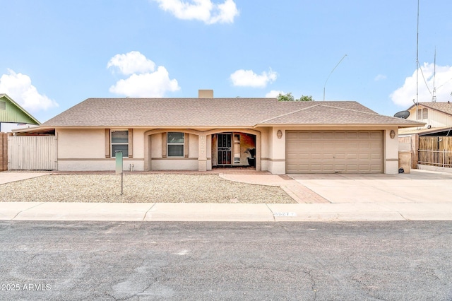 6527 W Sunnyside Dr, Glendale, AZ 85304 - single story home with driveway, stucco siding, and an attached garage