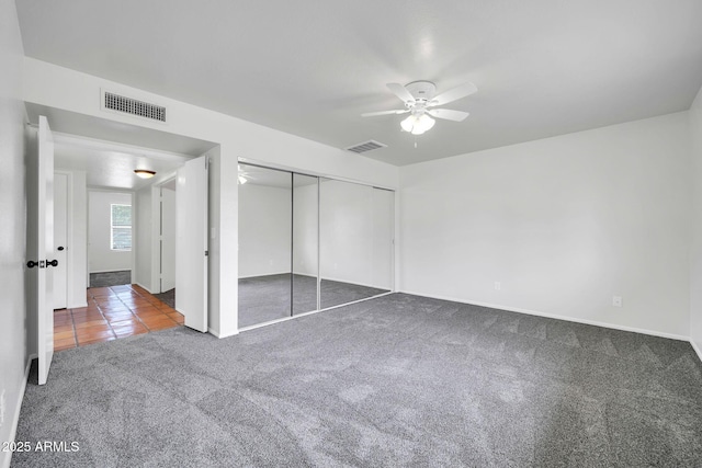 6527 W Sunnyside Dr, Glendale, AZ 85304 - unfurnished bedroom featuring carpet, visible vents, a closet, and ceiling fan