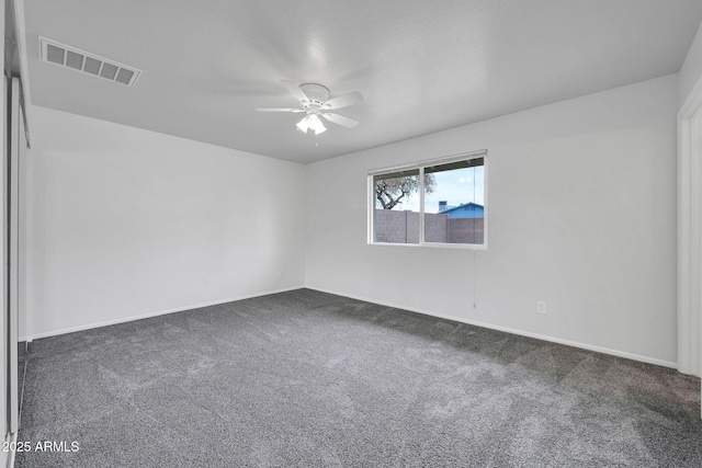 6527 W Sunnyside Dr, Glendale, AZ 85304 - carpeted spare room with baseboards, a ceiling fan, and visible vents