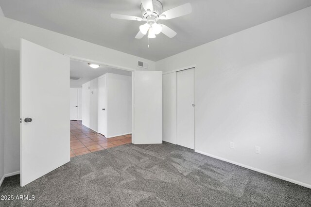 6527 W Sunnyside Dr, Glendale, AZ 85304 - carpeted empty room with tile patterned flooring, visible vents, and ceiling fan