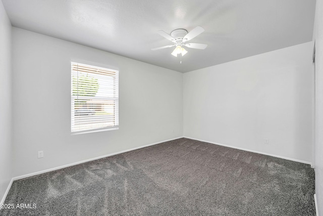 6527 W Sunnyside Dr, Glendale, AZ 85304 - spare room featuring baseboards, a ceiling fan, and carpet