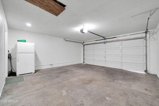 6527 W Sunnyside Dr, Glendale, AZ 85304 - garage featuring freestanding refrigerator and concrete block wall