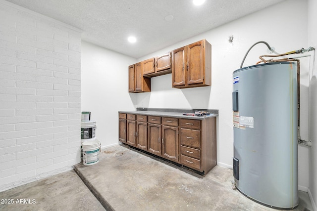 6527 W Sunnyside Dr, Glendale, AZ 85304 - kitchen with a textured ceiling, concrete flooring, recessed lighting, and water heater