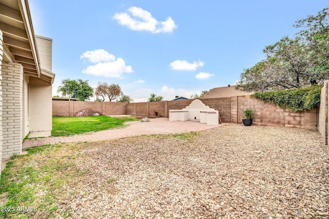 6527 W Sunnyside Dr, Glendale, AZ 85304 - view of yard featuring a patio area and a fenced backyard