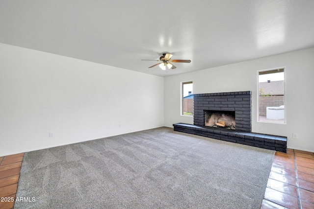 6527 W Sunnyside Dr, Glendale, AZ 85304 - unfurnished living room with baseboards, a ceiling fan, and a brick fireplace
