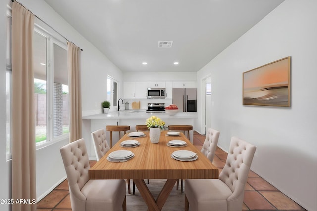 6527 W Sunnyside Dr, Glendale, AZ 85304 - dining space with visible vents, baseboards, recessed lighting, and light tile patterned floors