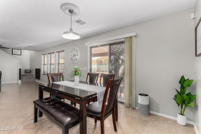 dining room featuring visible vents, baseboards, and light tile patterned flooring