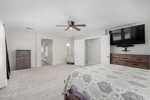 carpeted bedroom with visible vents, ceiling fan, and baseboards