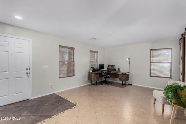 home office featuring tile patterned flooring and baseboards