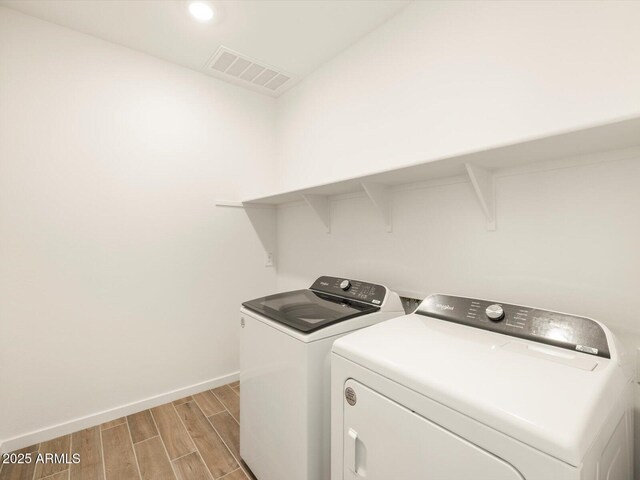 laundry area with washing machine and dryer