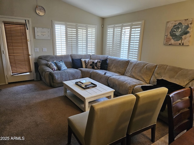 living room featuring lofted ceiling and carpet