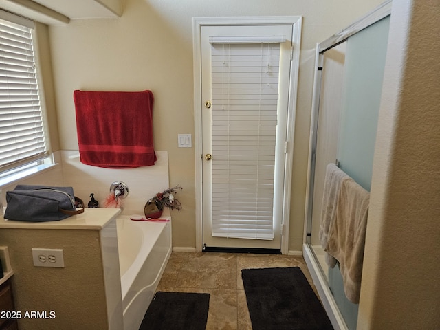 bathroom featuring plus walk in shower