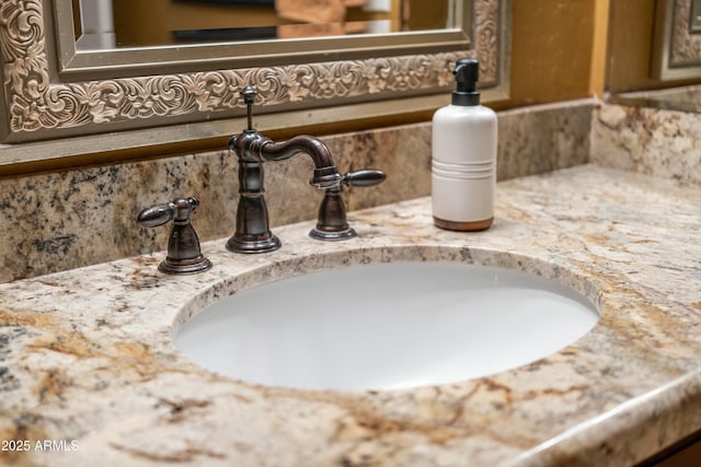 room details featuring vanity and decorative backsplash