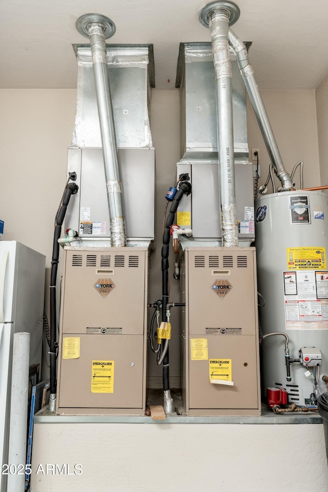 utility room featuring gas water heater