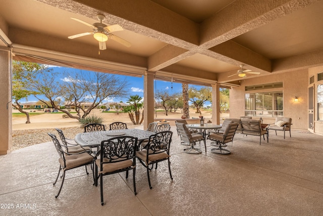 view of patio with a ceiling fan and outdoor dining space