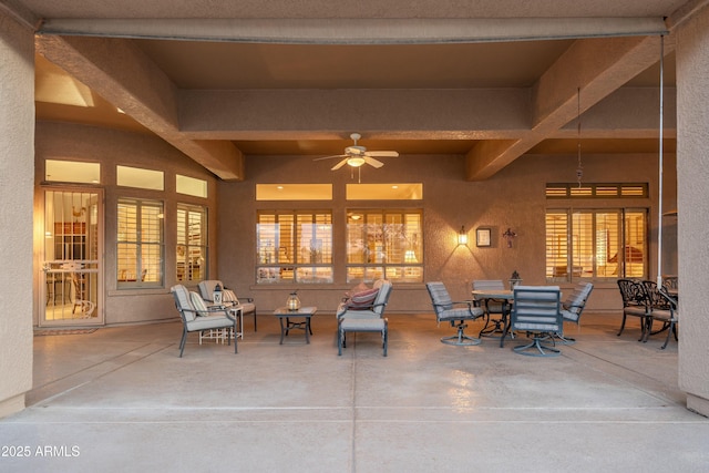 view of patio / terrace with a ceiling fan and outdoor dining space