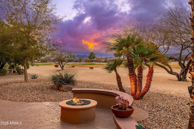 view of yard with an outdoor fire pit