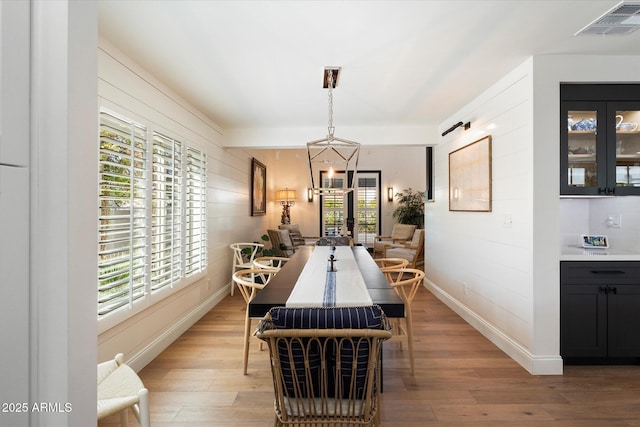 dining room with light hardwood / wood-style floors