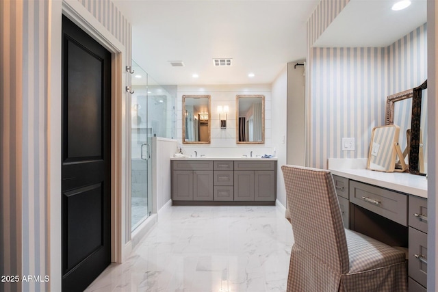 bathroom with vanity and an enclosed shower