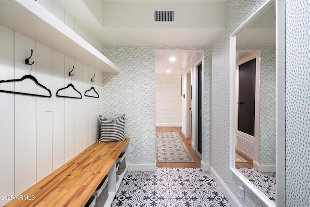 mudroom with light hardwood / wood-style flooring