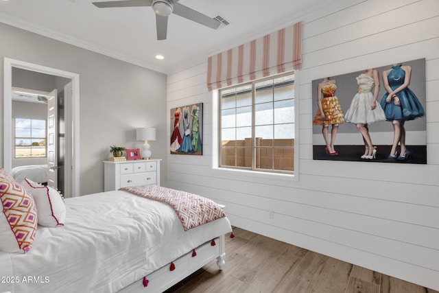 1145 E Gleneagle Dr, Chandler, AZ 85249 - bedroom with ornamental molding, wood walls, wood finished floors, and a ceiling fan