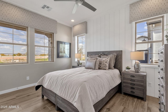 1145 E Gleneagle Dr, Chandler, AZ 85249 - bedroom featuring light wood-type flooring, crown molding, baseboards, a ceiling fan, and recessed lighting