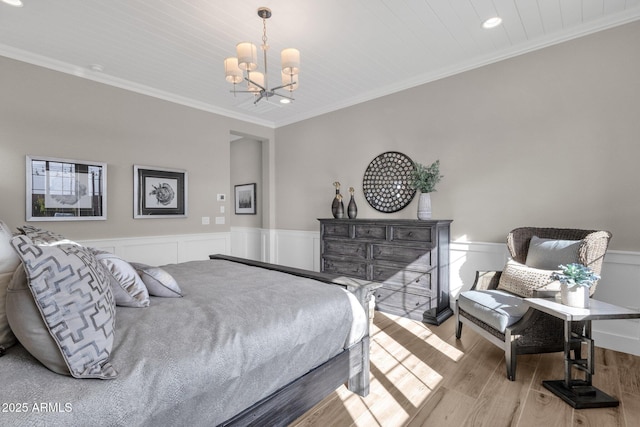 1145 E Gleneagle Dr, Chandler, AZ 85249 - bedroom with ornamental molding, a chandelier, wood finished floors, a wainscoted wall, and recessed lighting