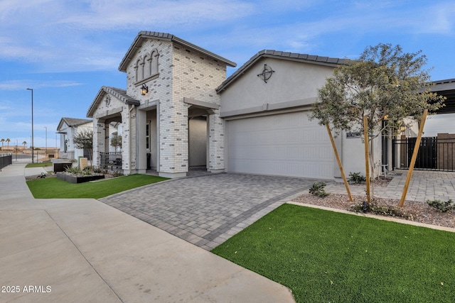 1145 E Gleneagle Dr, Chandler, AZ 85249 - view of front of house with an attached garage, driveway, brick siding, and stucco siding