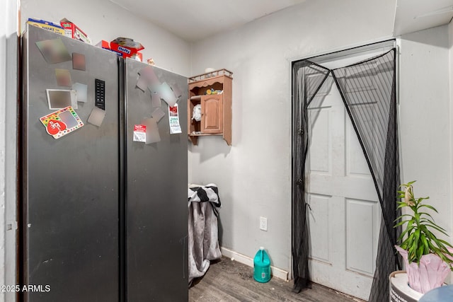 9353 W Monroe St, Tolleson, AZ 85353 - clothes washing area featuring wood finished floors and baseboards