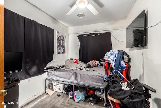 9353 W Monroe St, Tolleson, AZ 85353 - bedroom featuring ceiling fan and wood finished floors