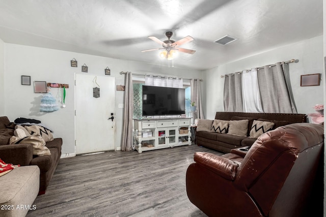 9353 W Monroe St, Tolleson, AZ 85353 - living room with a ceiling fan, wood finished floors, and baseboards