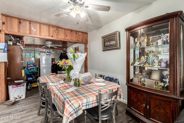 9353 W Monroe St, Tolleson, AZ 85353 - dining room featuring ceiling fan and wood finished floors