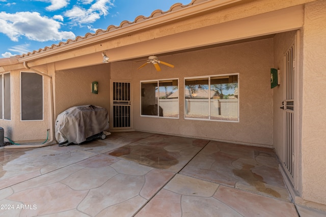 view of patio / terrace with area for grilling and ceiling fan