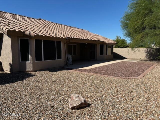 rear view of property featuring a patio