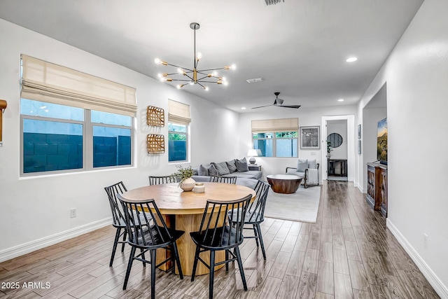 dining area featuring recessed lighting, wood finished floors, and baseboards