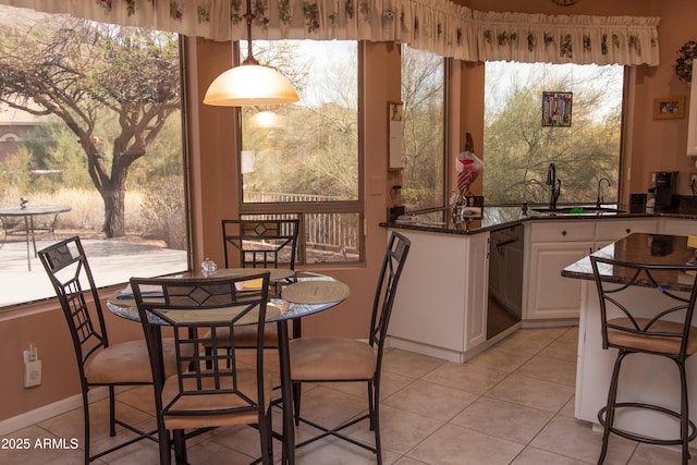 dining area with light tile patterned floors