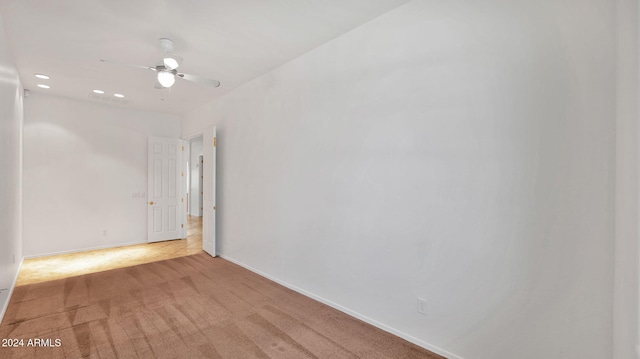 carpeted empty room with ceiling fan