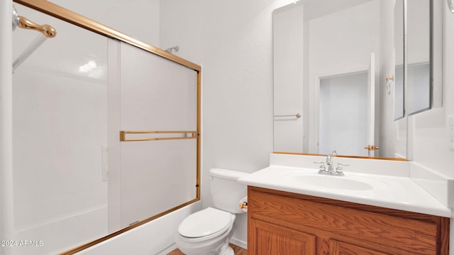 full bathroom featuring vanity, toilet, and enclosed tub / shower combo