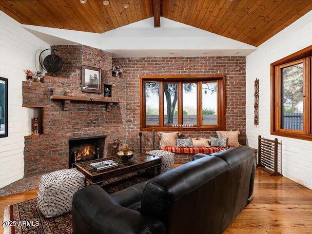 8022 N Ironwood Dr, Paradise Valley, AZ 85253 - living room with wood finished floors, healthy amount of natural light, a brick fireplace, brick wall, and wood ceiling