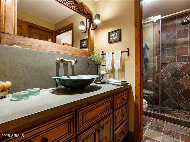 8022 N Ironwood Dr, Paradise Valley, AZ 85253 - bathroom featuring vanity, a stall shower, and toilet