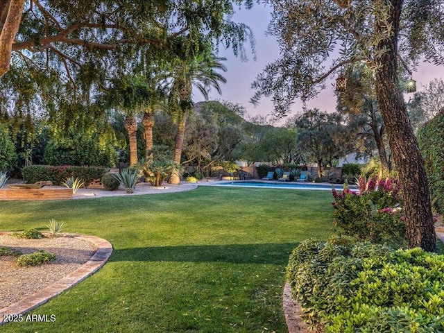 8022 N Ironwood Dr, Paradise Valley, AZ 85253 - view of green lawn with an outdoor pool