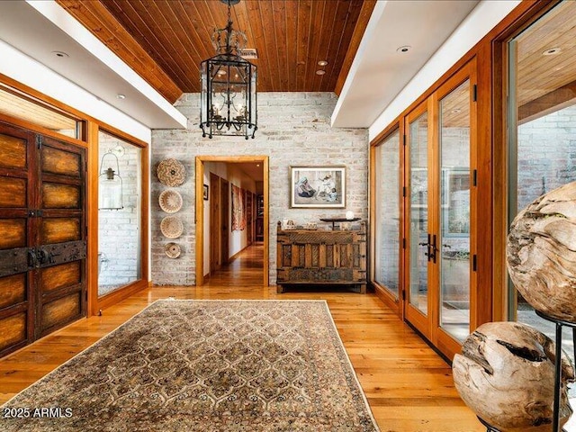 8022 N Ironwood Dr, Paradise Valley, AZ 85253 - foyer entrance with wood ceiling, a chandelier, french doors, and wood-type flooring