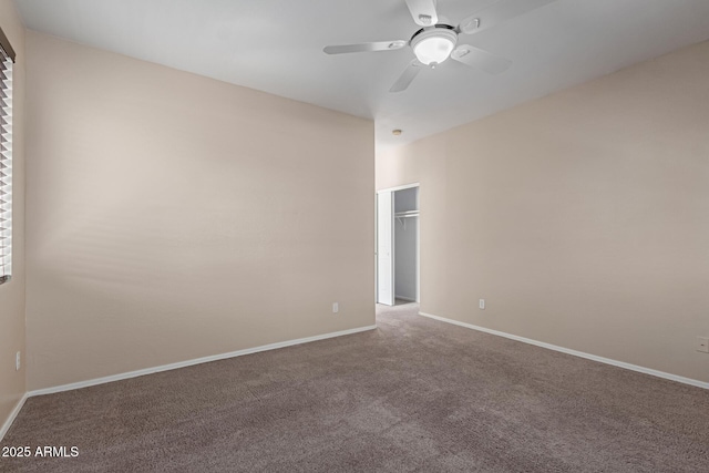 empty room with a ceiling fan, baseboards, and carpet floors